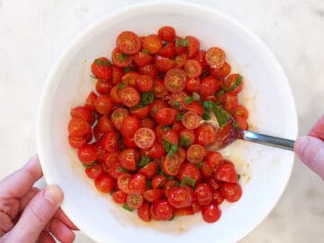 Mixing the salad.