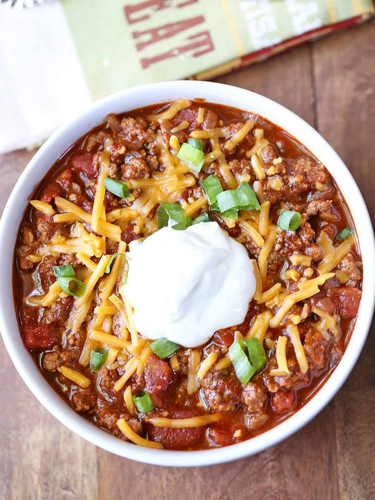 No bean chili is served in a white bowl with a napkin.
