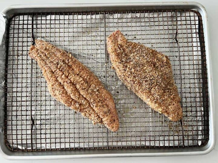 Placing the fish in the pan.