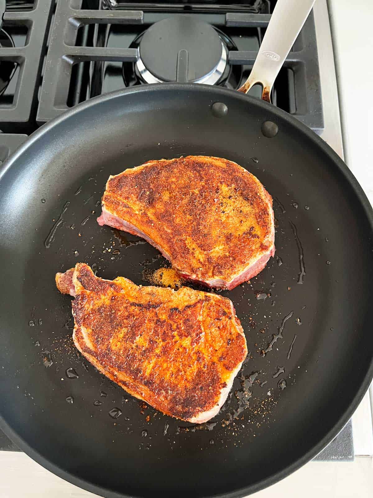 Cooking pork chops in a nonstick skillet.