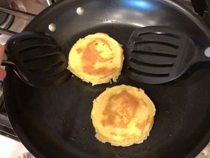 Toasting the bread in a skillet.