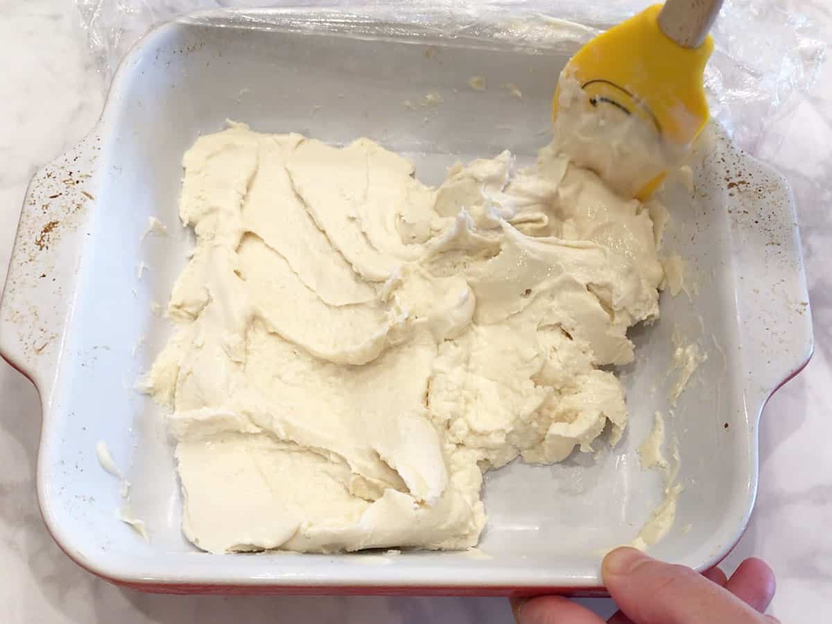 Stirring the mixture again in the pan.