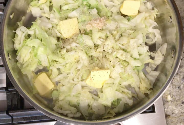 Adding butter, garlic, salt, and pepper.