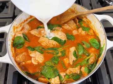 Adding a cornstarch slurry to the stew.
