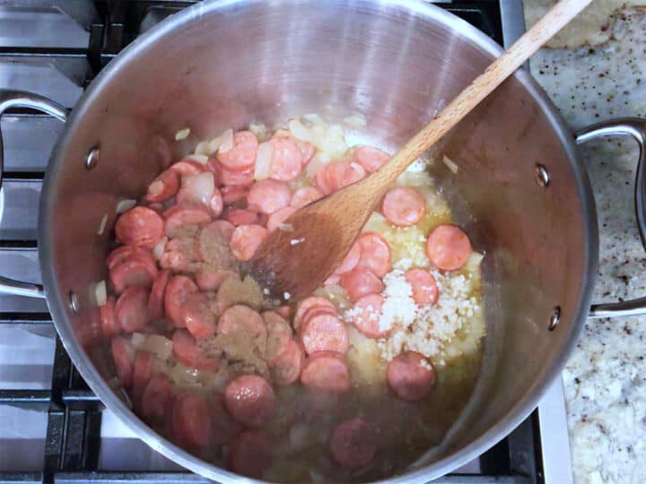 Adding spices to the pot.