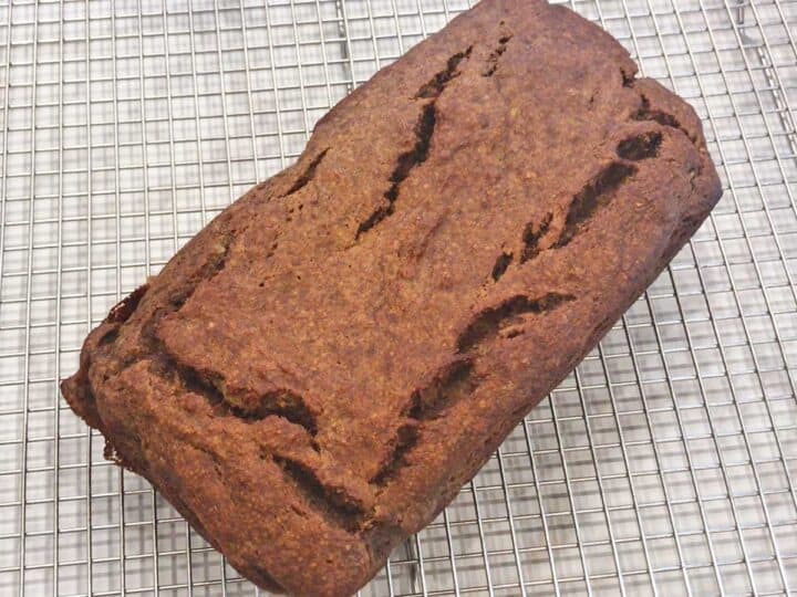 The bread is cooling on a wire rack.