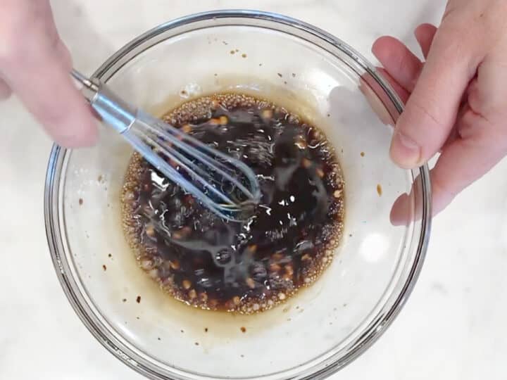 Mixing the sauce in a bowl.