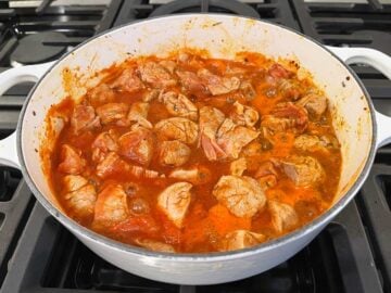 Simmering the stew on the stovetop.