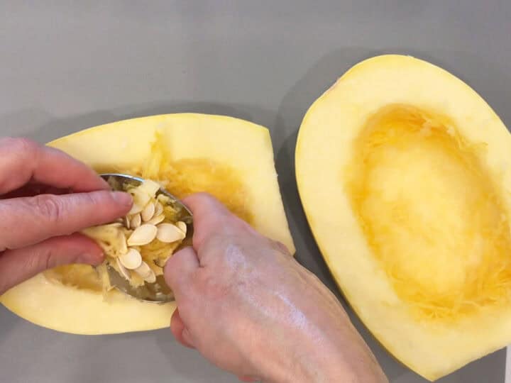 Removing the seeds and pulp.