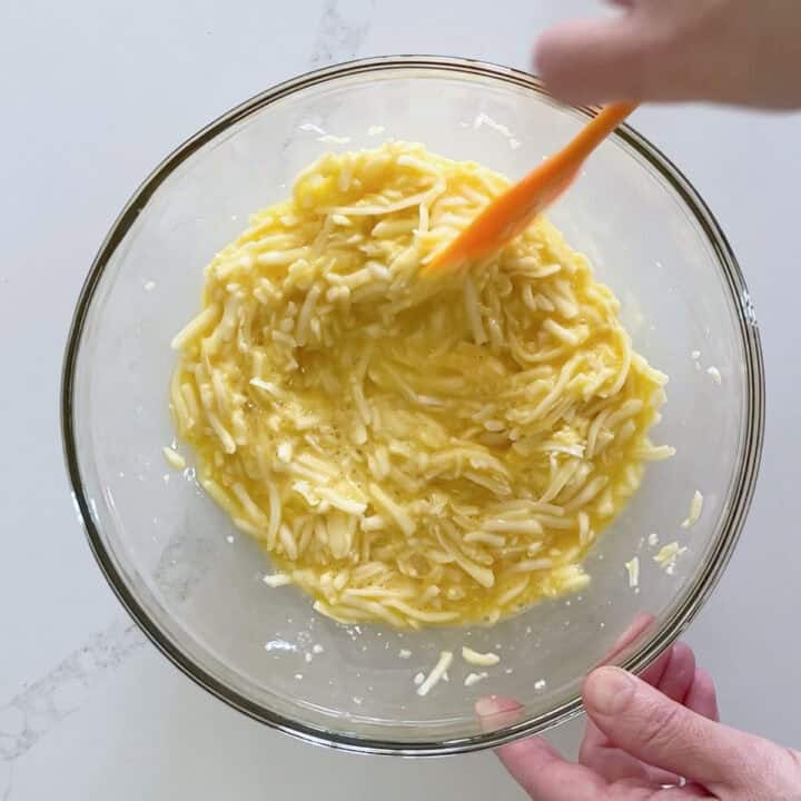 Combining the ingredients in a bowl.