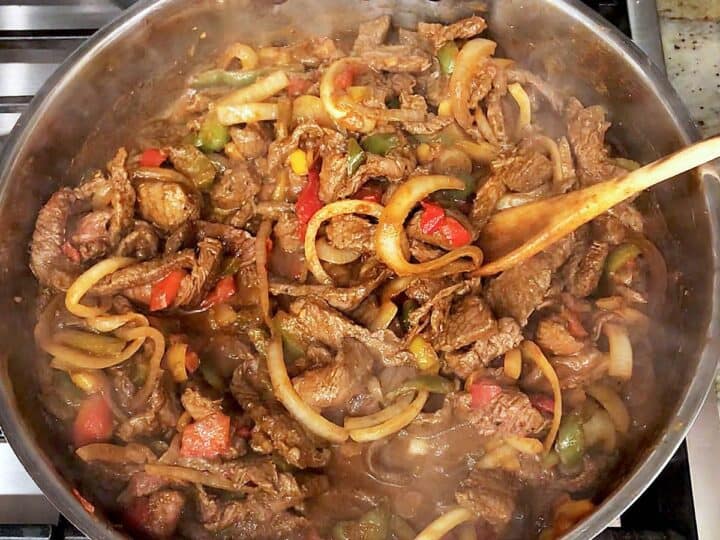 Adding back the veggies to the skillet.