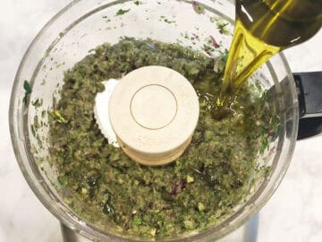 Adding olive oil.