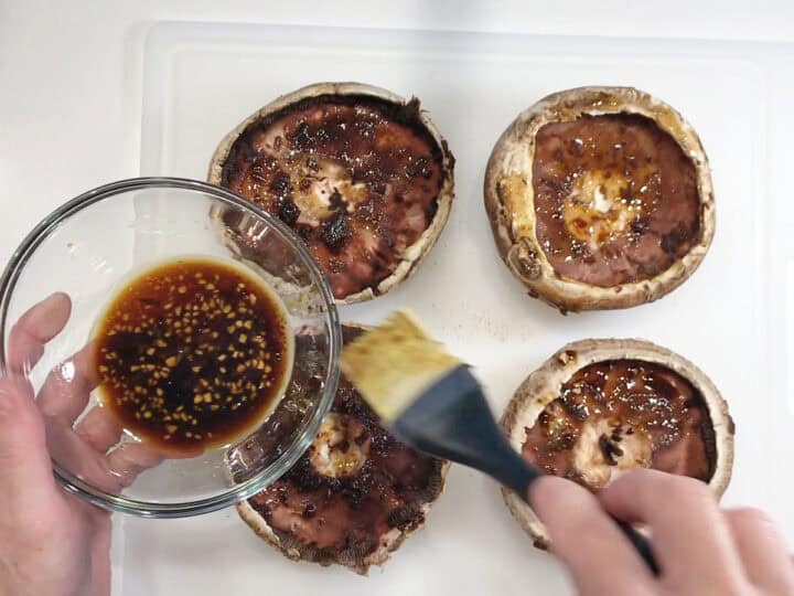 Brushing the gill side with the marinade.