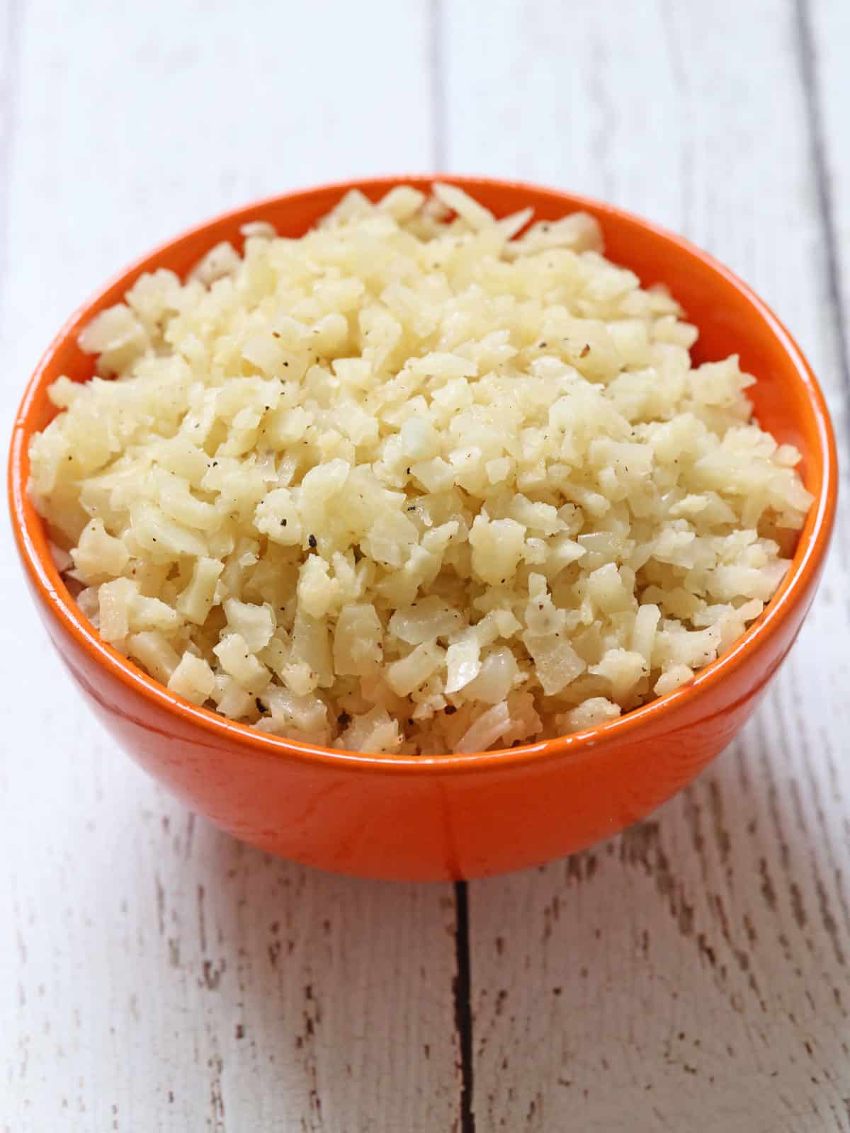 Cauliflower rice is served in a bowl.