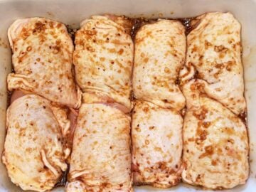 The chicken is coated in the marinade.