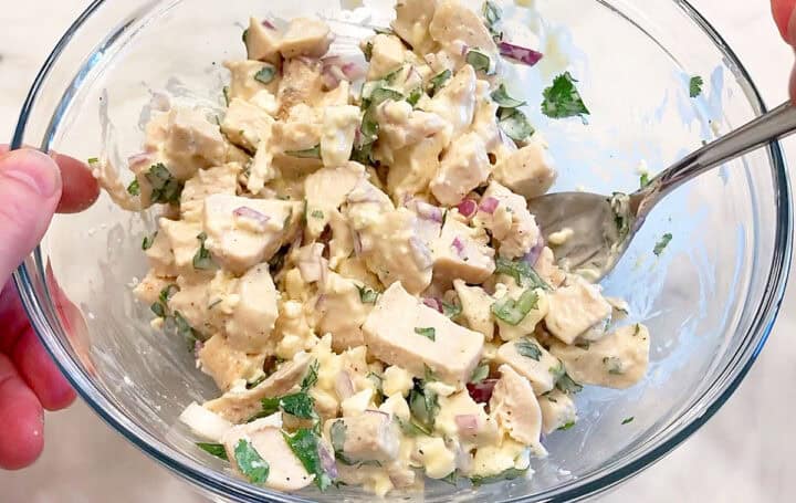 Mixing the salad.