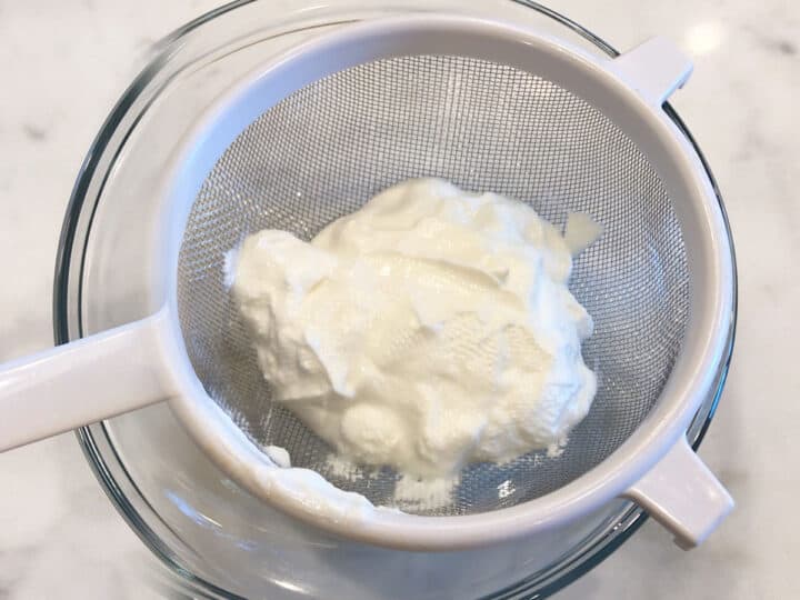 Straining the yogurt.