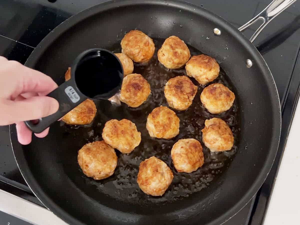 Adding water to the skillet.