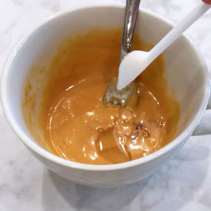 Adding a sweetener to the batter.