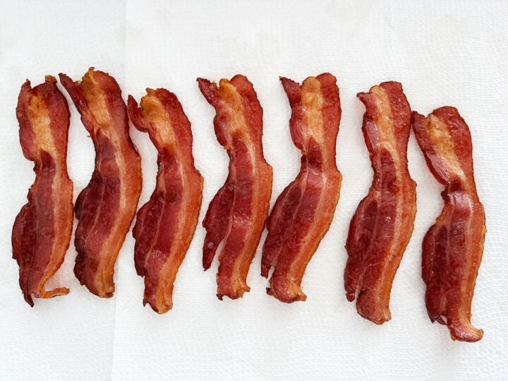 Draining bacon on paper towels.