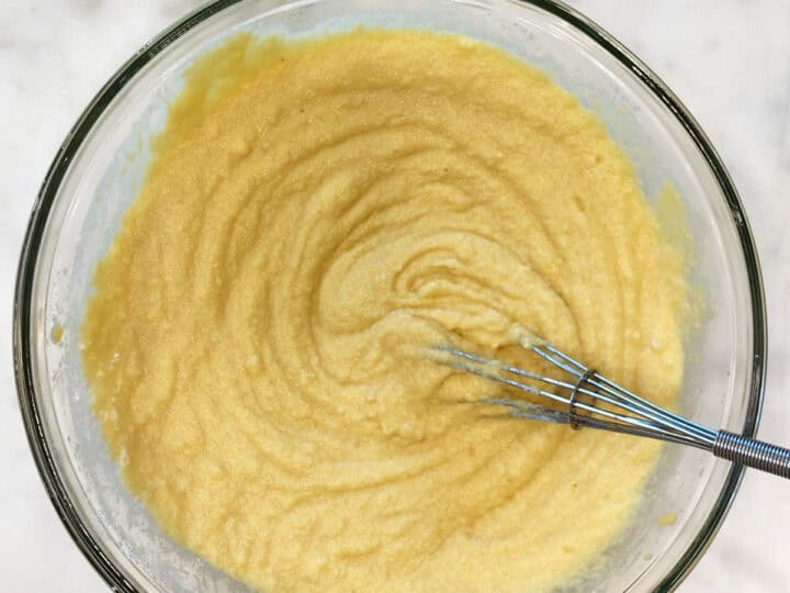 Mixing the dry ingredients into the batter.