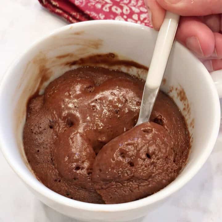Eating the cake with a spoon.