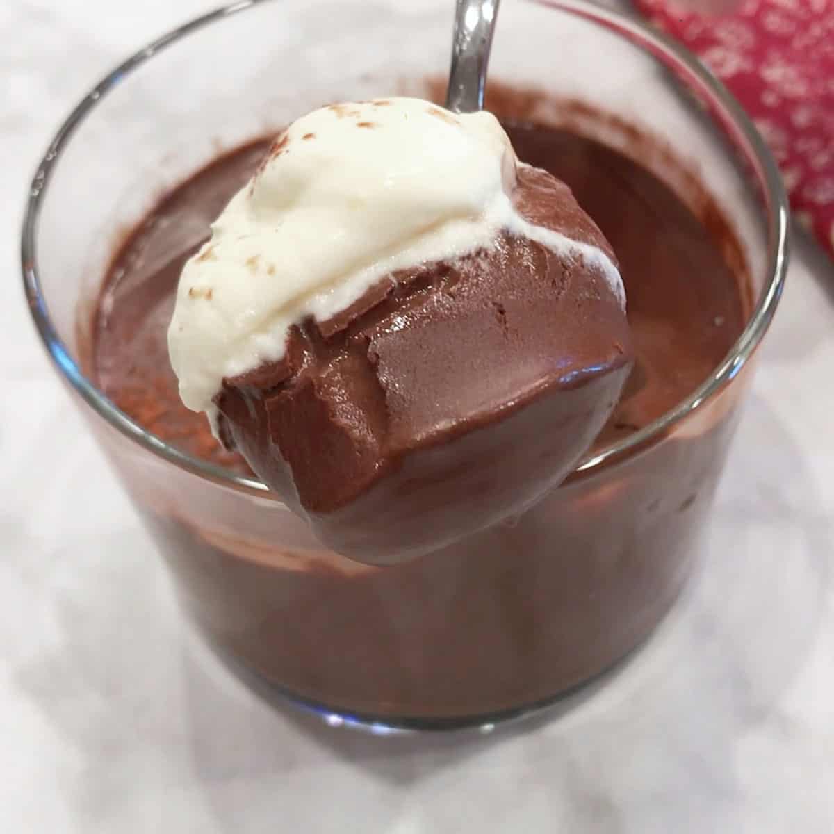 Scooping out the pudding with a spoon.