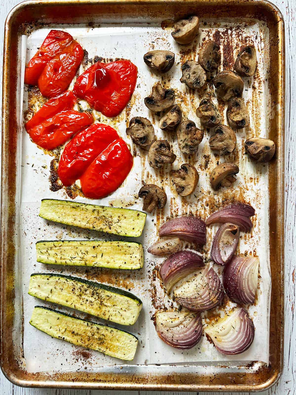 Roasted vegetables on a sheet pan.