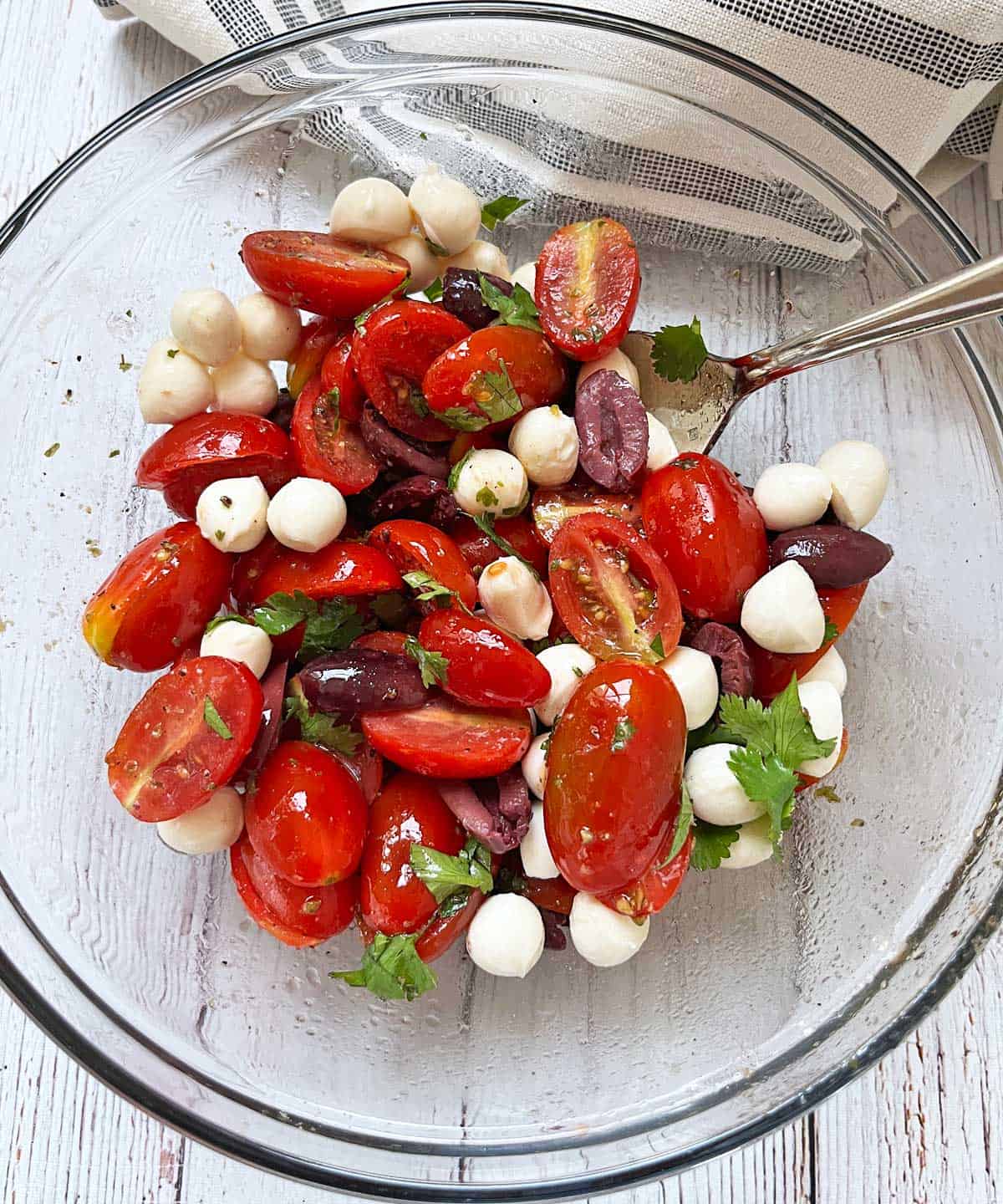 Cherry tomato salad with cilantro, olives, and mozzarella.