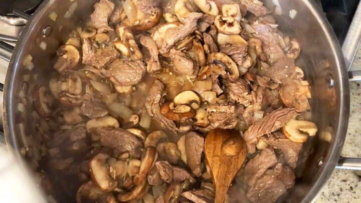 The beef was added back to the skillet.