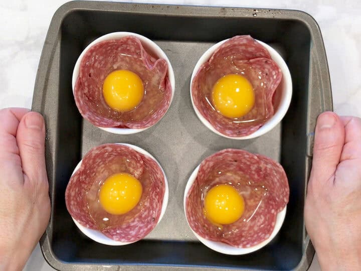 The eggs were added to the ramekins.