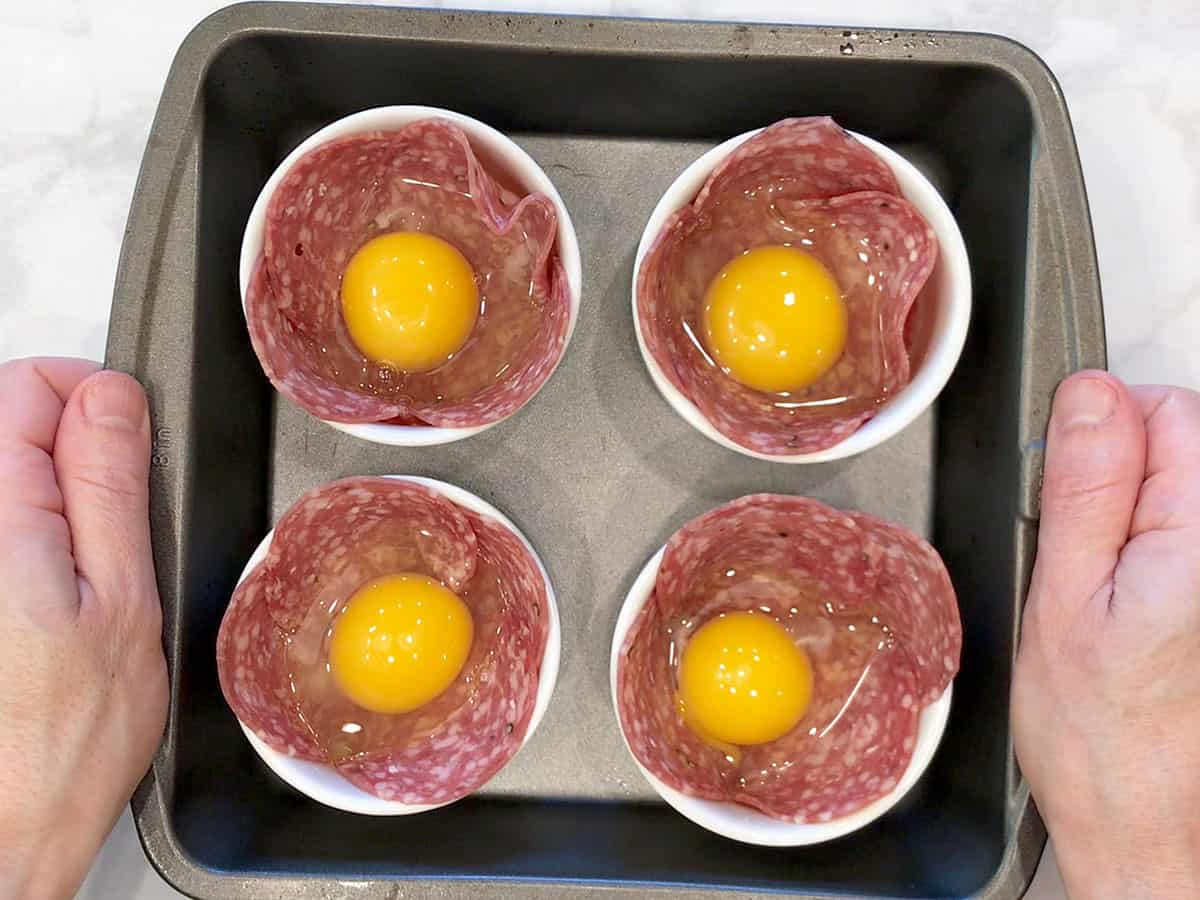 The eggs were added to the ramekins.