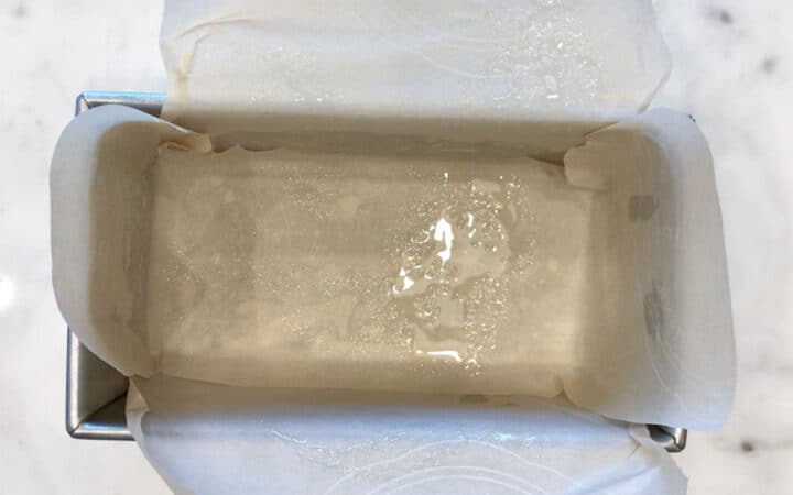 Lined and greased loaf pan.