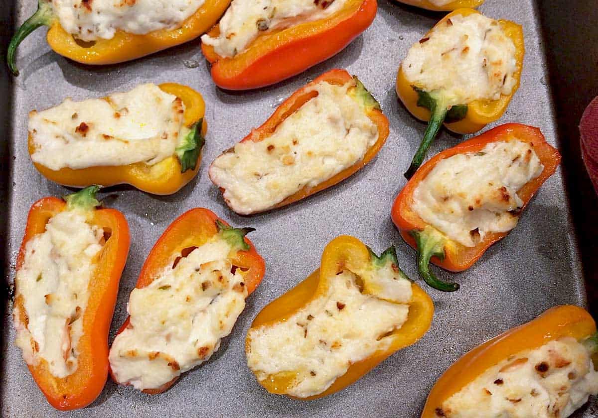 Stuffed mini peppers are ready in the pan.