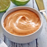 Sriracha mayo is served in a white bowl.