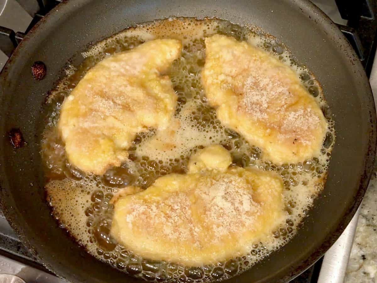 Cooking the tenders in a skillet.
