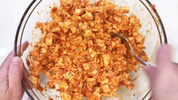 Mixing the casserole ingredients in a bowl.