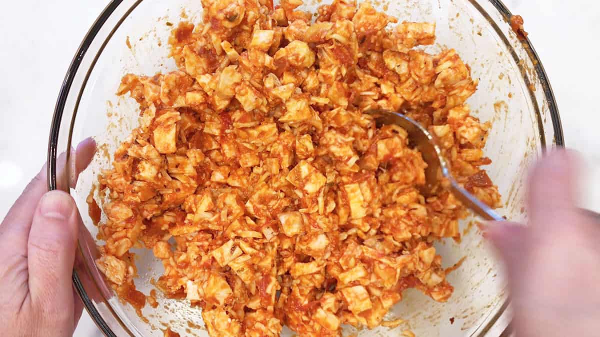 Mixing the casserole ingredients in a bowl.