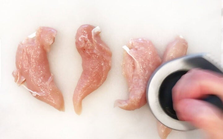 Pounding the chicken tenders.