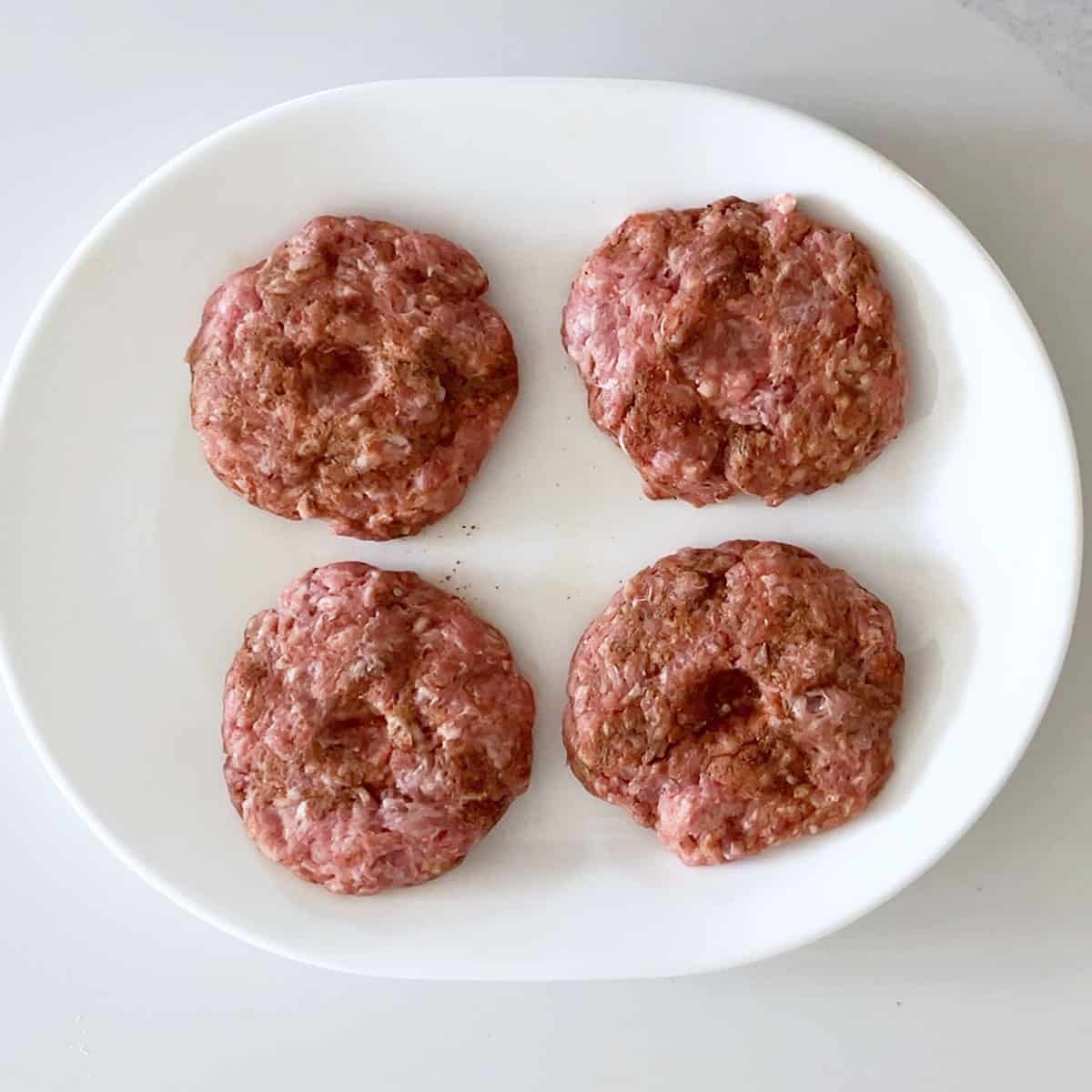 The shaped burgers are ready for the skillet.