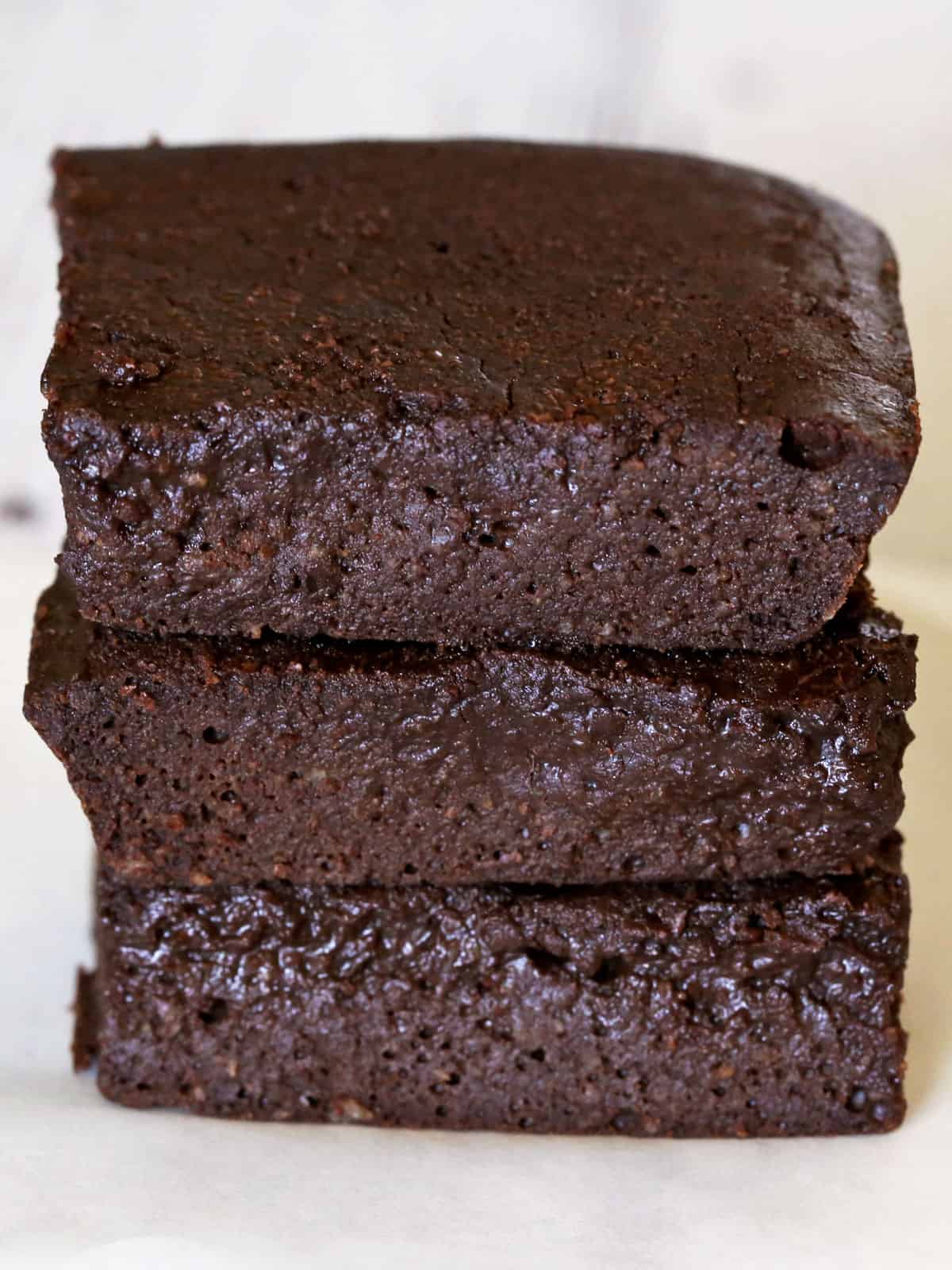 A stack of three keto brownies.