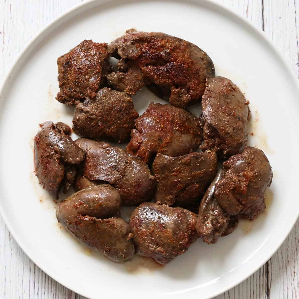 Chicken livers are seasoned with garlic powder and paprika.