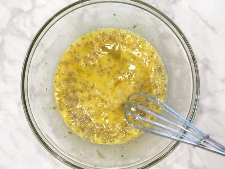 Mixing eggs and spices.