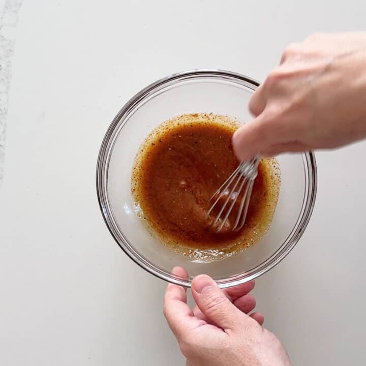 Mixing the marinade in a bowl.