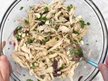Mixing the salad.