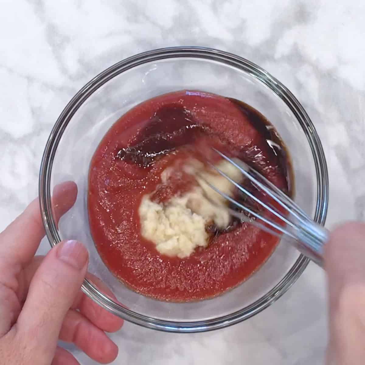 Mixing the sauce ingredients.