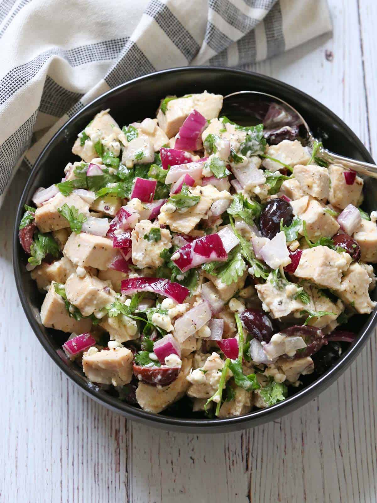 No mayo chicken salad is served in a bowl with a spoon.