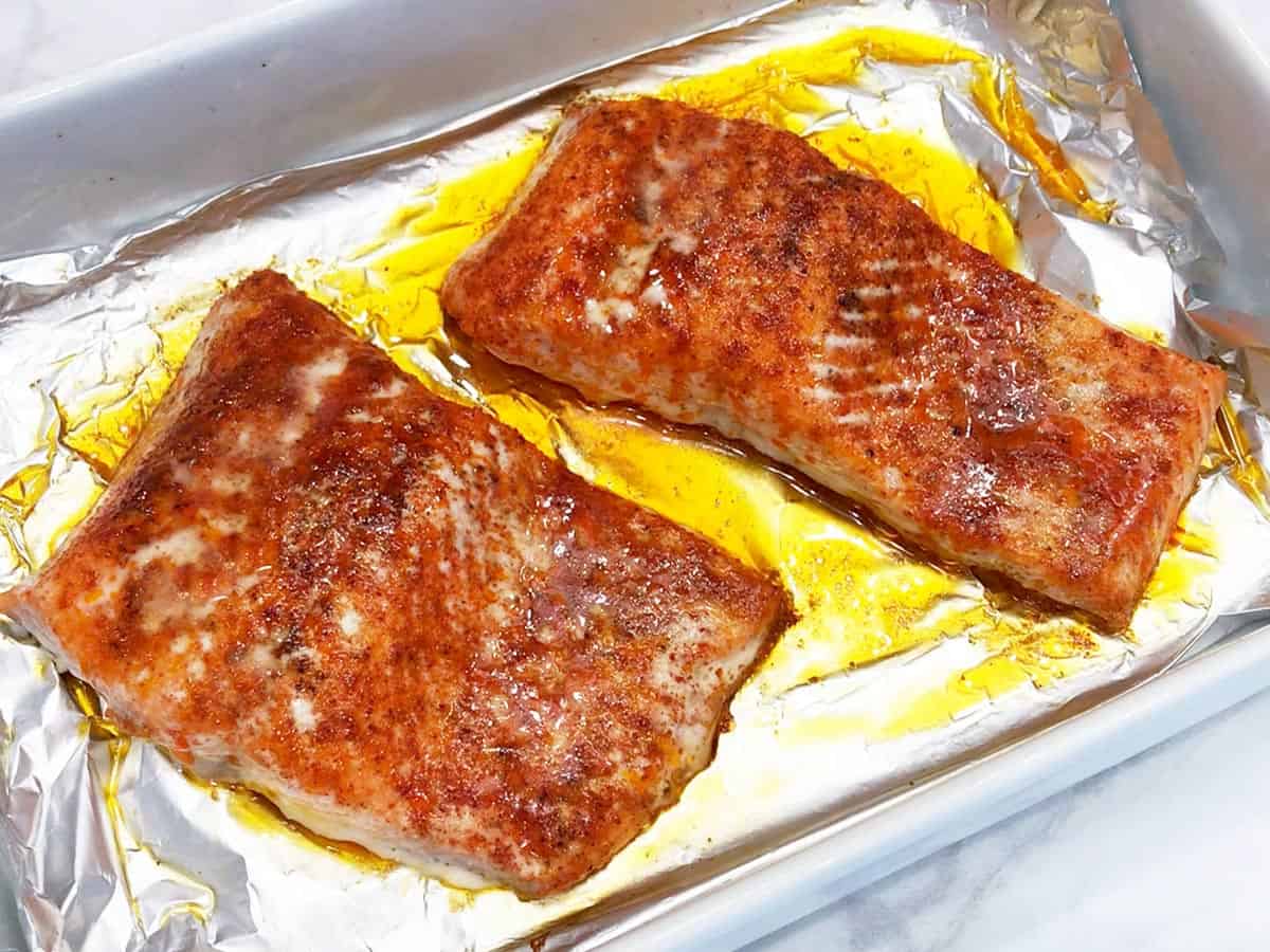 The salmon is ready in the baking dish.