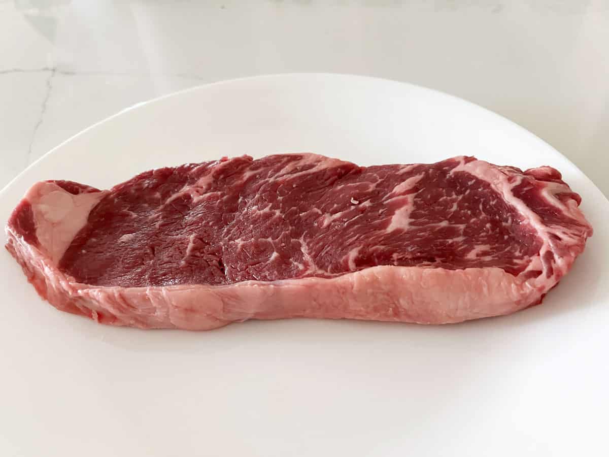 A thin, ½-inch-thick strip steak.