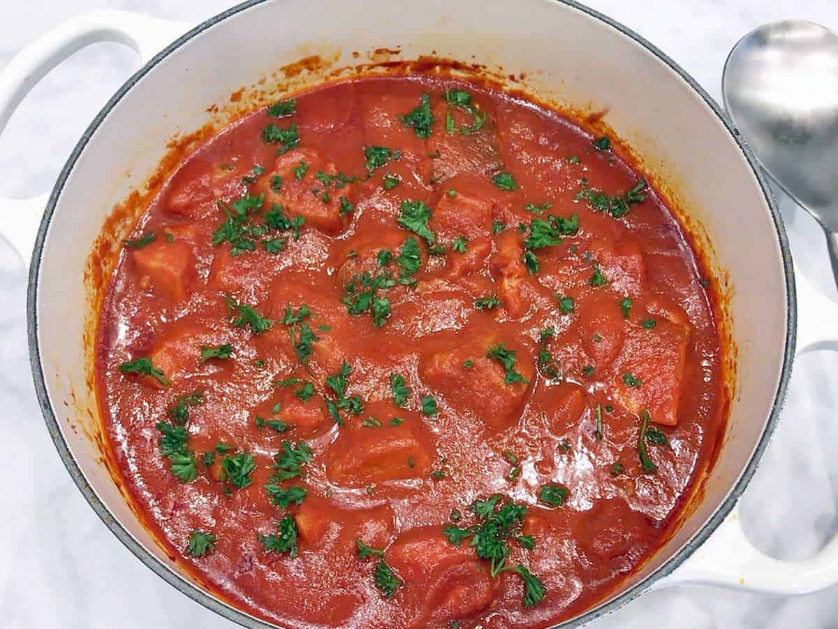 The stew is served with a spoon.